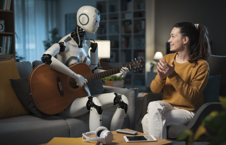 A humanoid robot playing a guitar with a human.